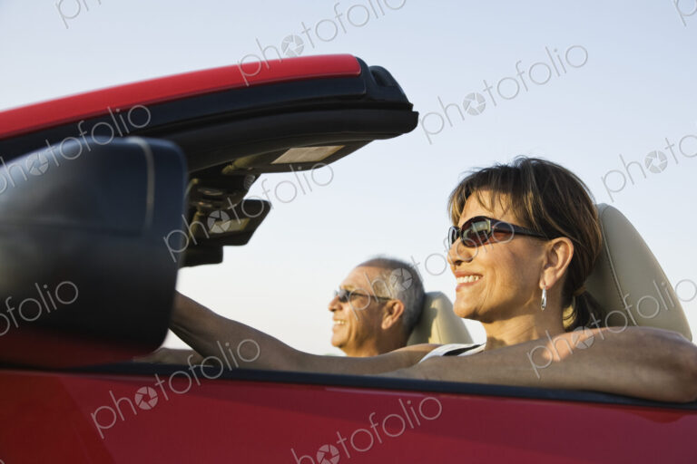 A hip senior Hispanic couple on a road trip in eastern Washington State, USA.