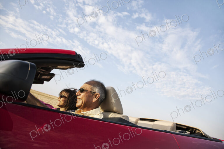 A hip senior Hispanic couple on a road trip in eastern Washington State, USA.