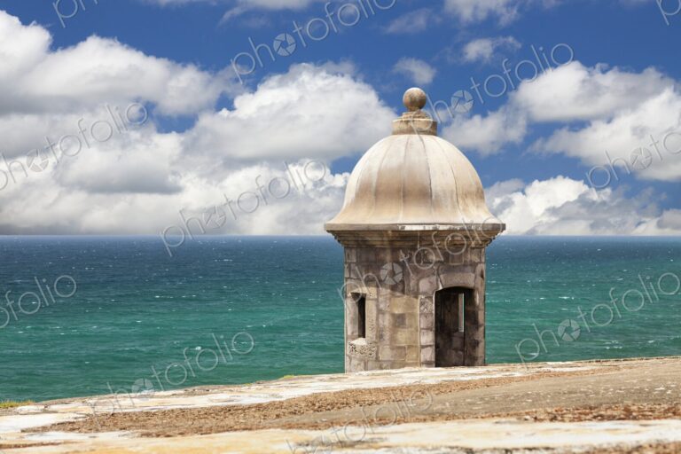 A historic stone sentry box stands watch over the Atlantic Ocean at Castillo San…