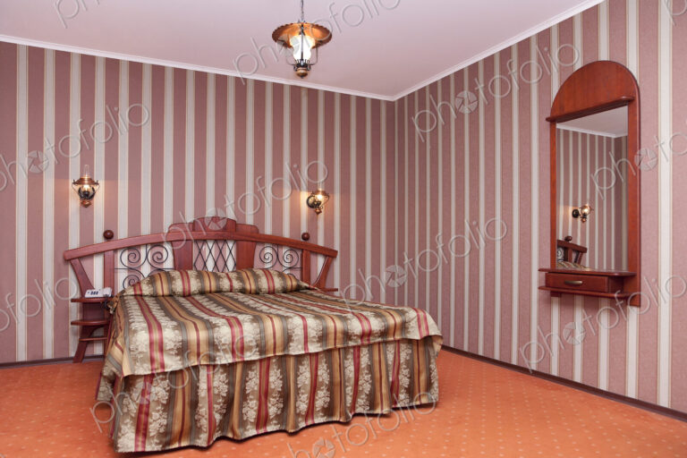 A hotel bedroom with a vintage look