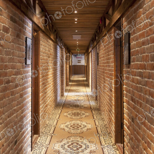 A hotel corridor with a vintage runner carpet A hotel corridor with a vintage runner carpet