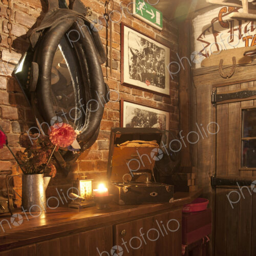 A hotel with old fashioned retro styled rooms, and rustic objects, bar with horse harness. A hotel with old fashioned retro styled rooms, and rustic objects, bar with horse harness.