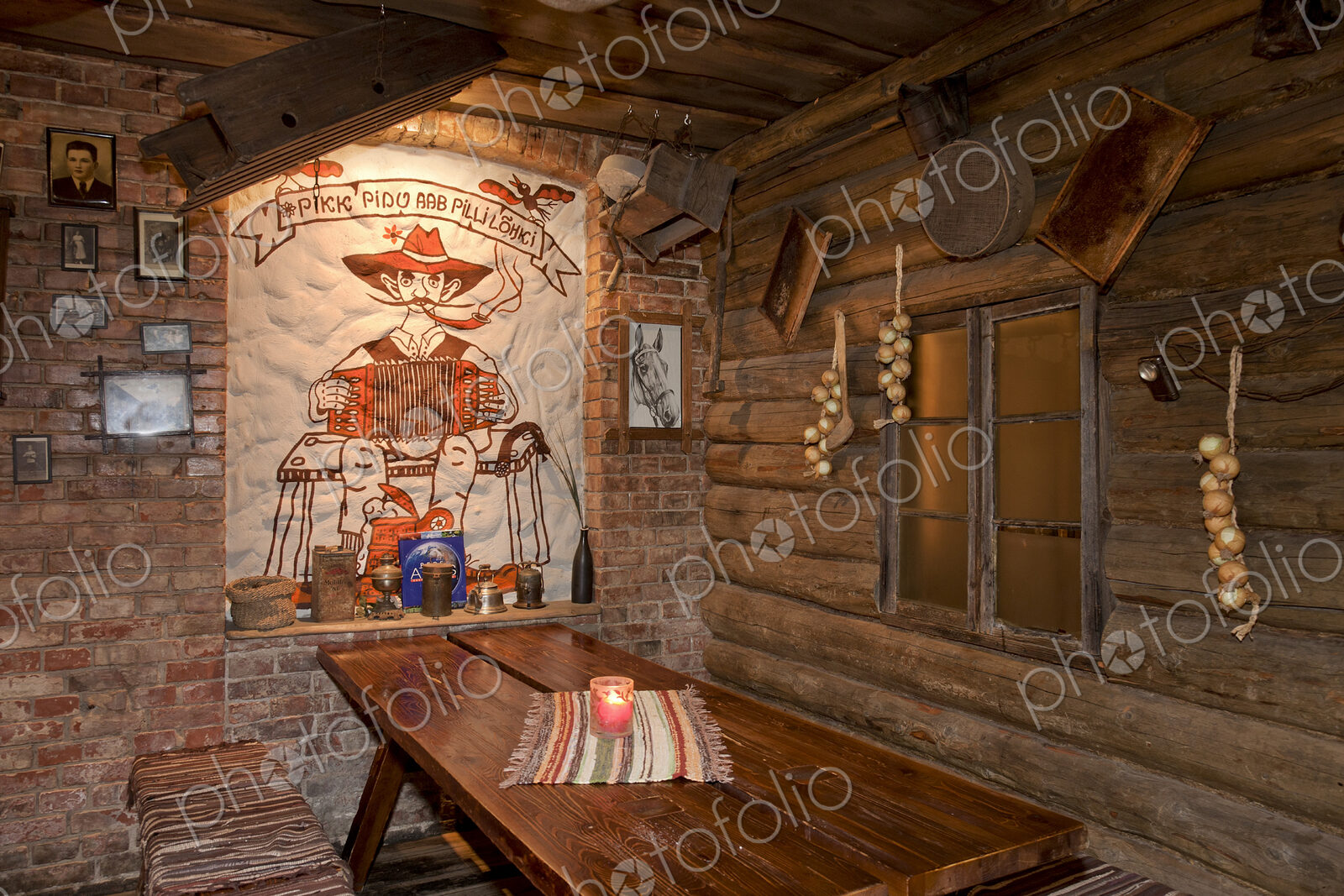 A hotel with old fashioned retro styled rooms, and rustic objects, bench and tables