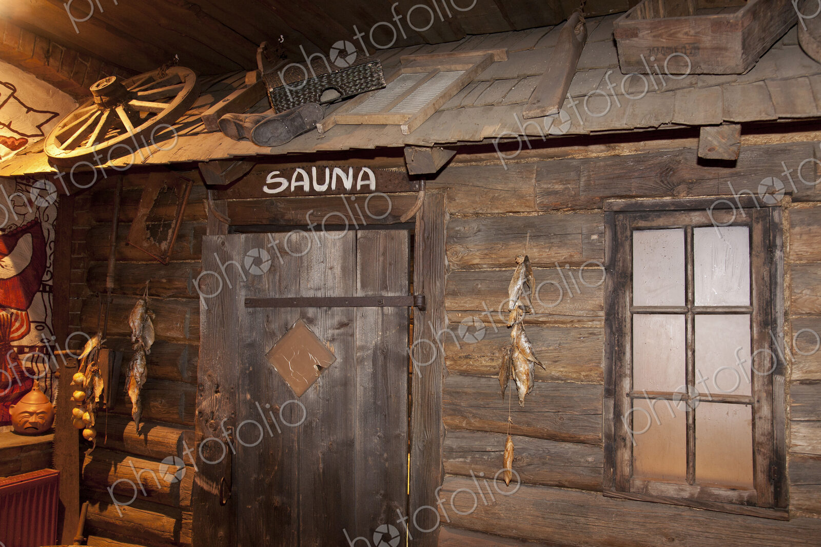 A hotel with old fashioned retro styled rooms and rustic objects, door to the sauna.