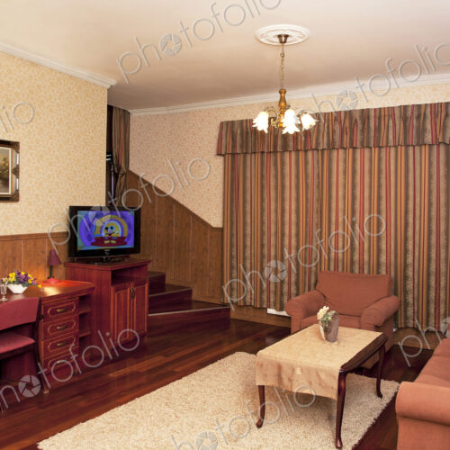 A hotel with old fashioned retro styled rooms, and rustic objects, sofa and chairs and… A hotel with old fashioned retro styled rooms, and rustic objects, sofa and chairs and…