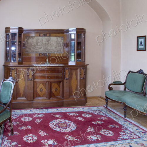 A large antique display cabinet, storage, a carpet and antique style chairs and desk… A large antique display cabinet, storage, a carpet and antique style chairs and desk…