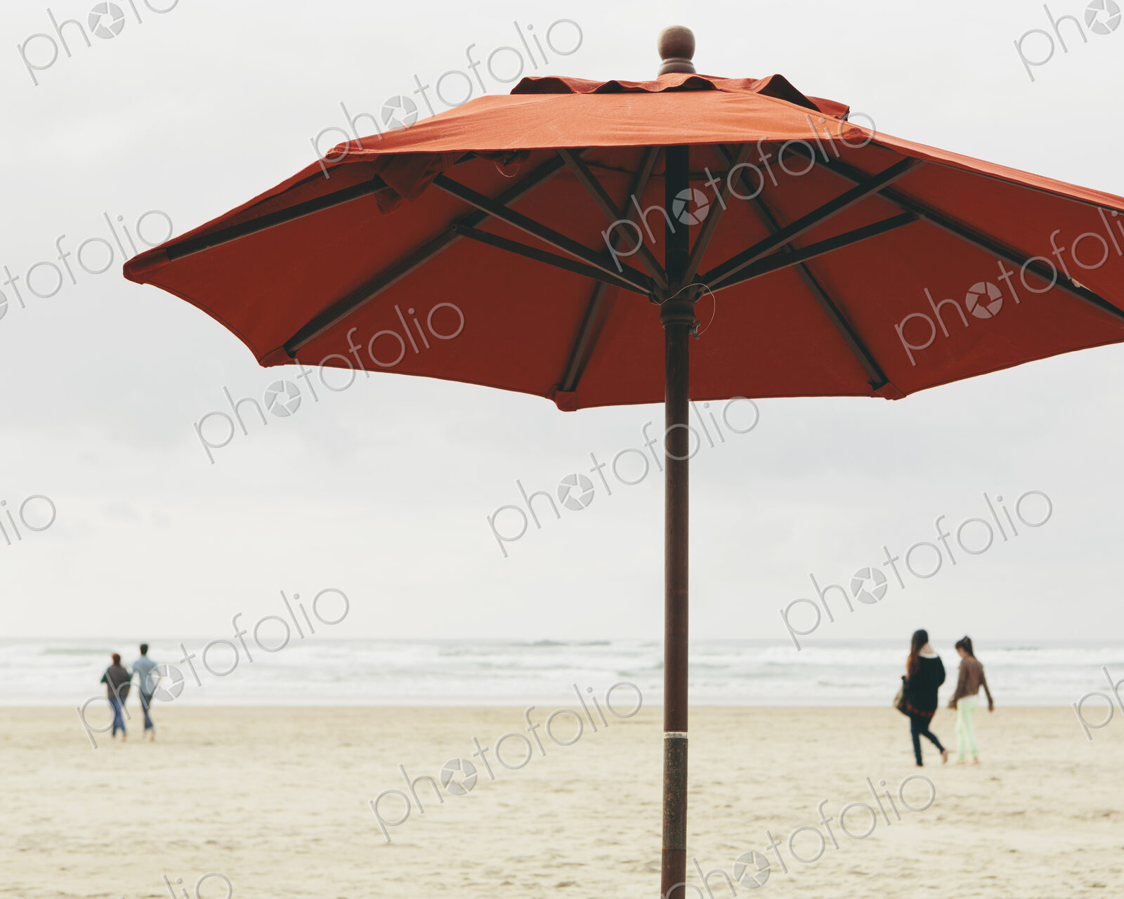 A large beach umbrella on the beach at Manzanita, on the Pacific Ocean in Oregon.