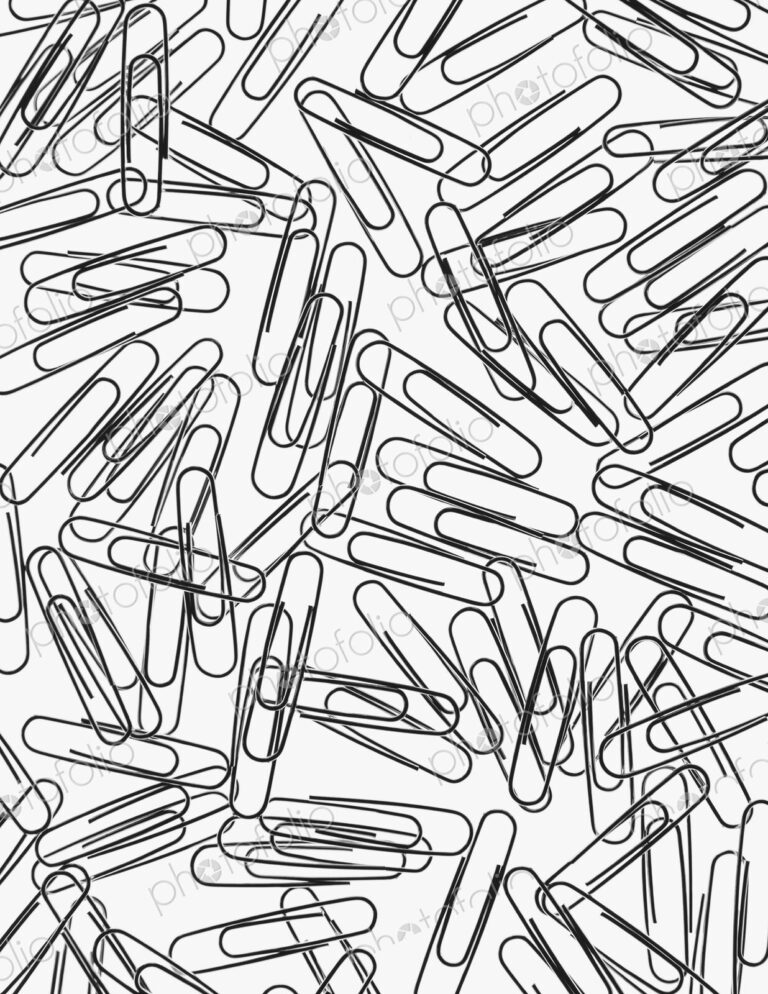 A large group of metal paperclips on a white background.