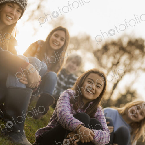 A large group of young children, girls and boys outdoors on a winter day, on an… A large group of young children, girls and boys outdoors on a winter day, on an…