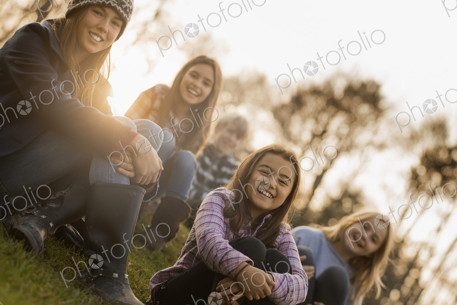 A large group of young children, girls and boys outdoors on a winter day, on an…