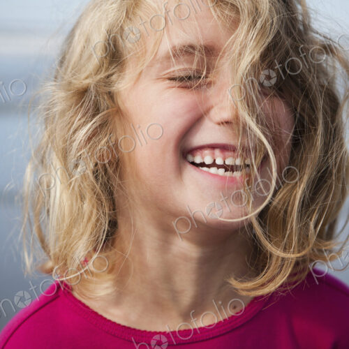 A laughing six year old gir. A portrait. A laughing six year old gir. A portrait.
