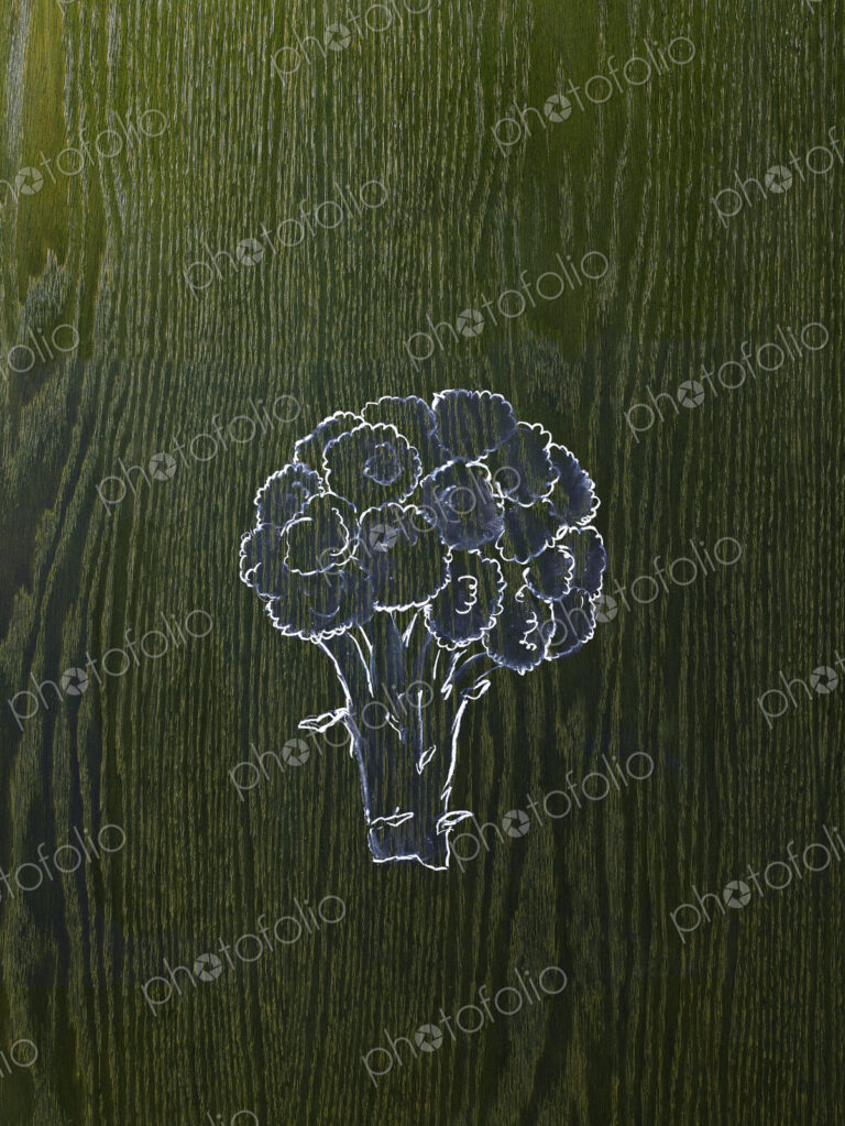 A line drawing image on a natural wood grain background. A head of broccoli, florets…