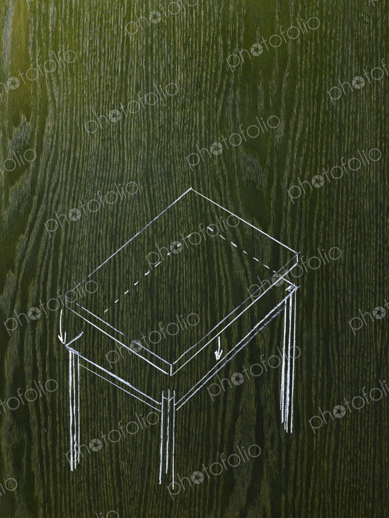 A line drawing image on a natural wood grain background. A rectangular table with a…