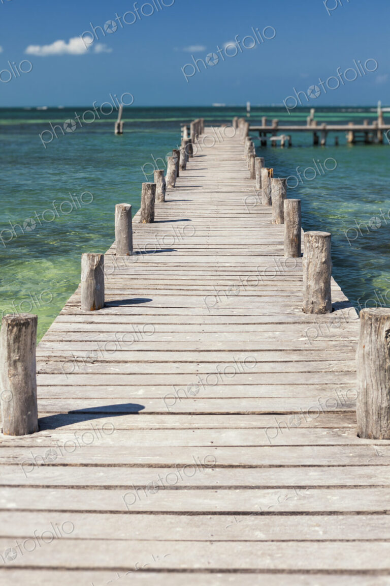 A long wooden jetty or pier,stretching out over the water