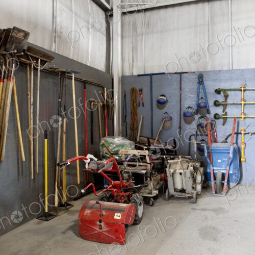 A maintenance shed at an airport, toolshed, tools and objects stored.