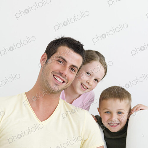 A man and two children at home, a boy and a girl. A man and two children at home, a boy and a girl.