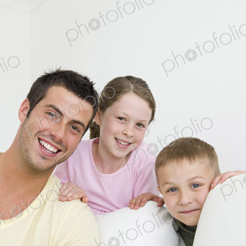 A man and two children at home, a boy and a girl. A man and two children at home, a boy and a girl.