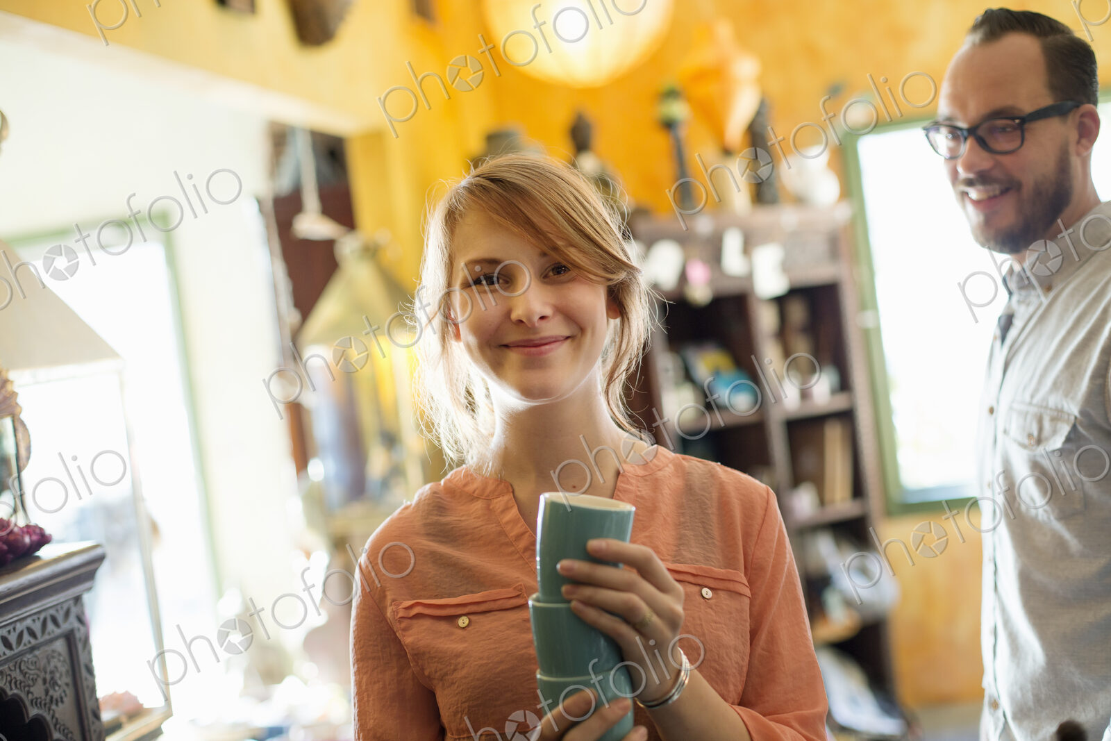 A man and woman, a couple running a business. An antique store.