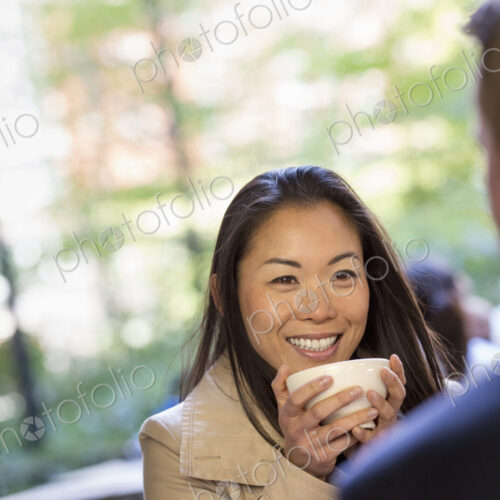 A man and woman sitting in a coffee shop. A man and woman sitting in a coffee shop.
