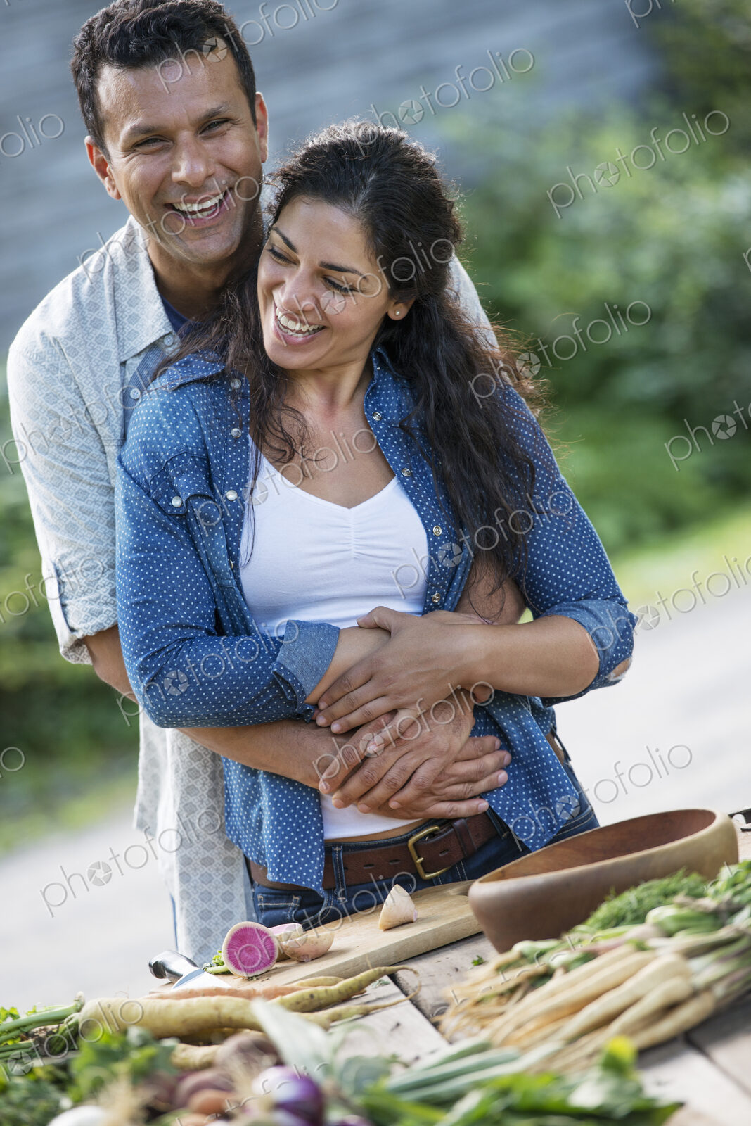 A man and woman together outdoors in summer.
