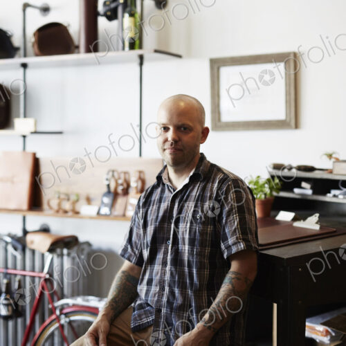 A man, craftsman and leather worker in a leather workshop. A man, craftsman and leather worker in a leather workshop.