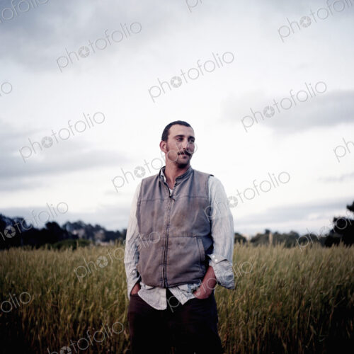 A man standing in the field at the social care and work project, the Homeless Garden… A man standing in the field at the social care and work project, the Homeless Garden…