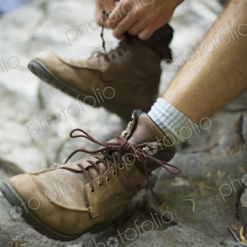 A man taking his boots off