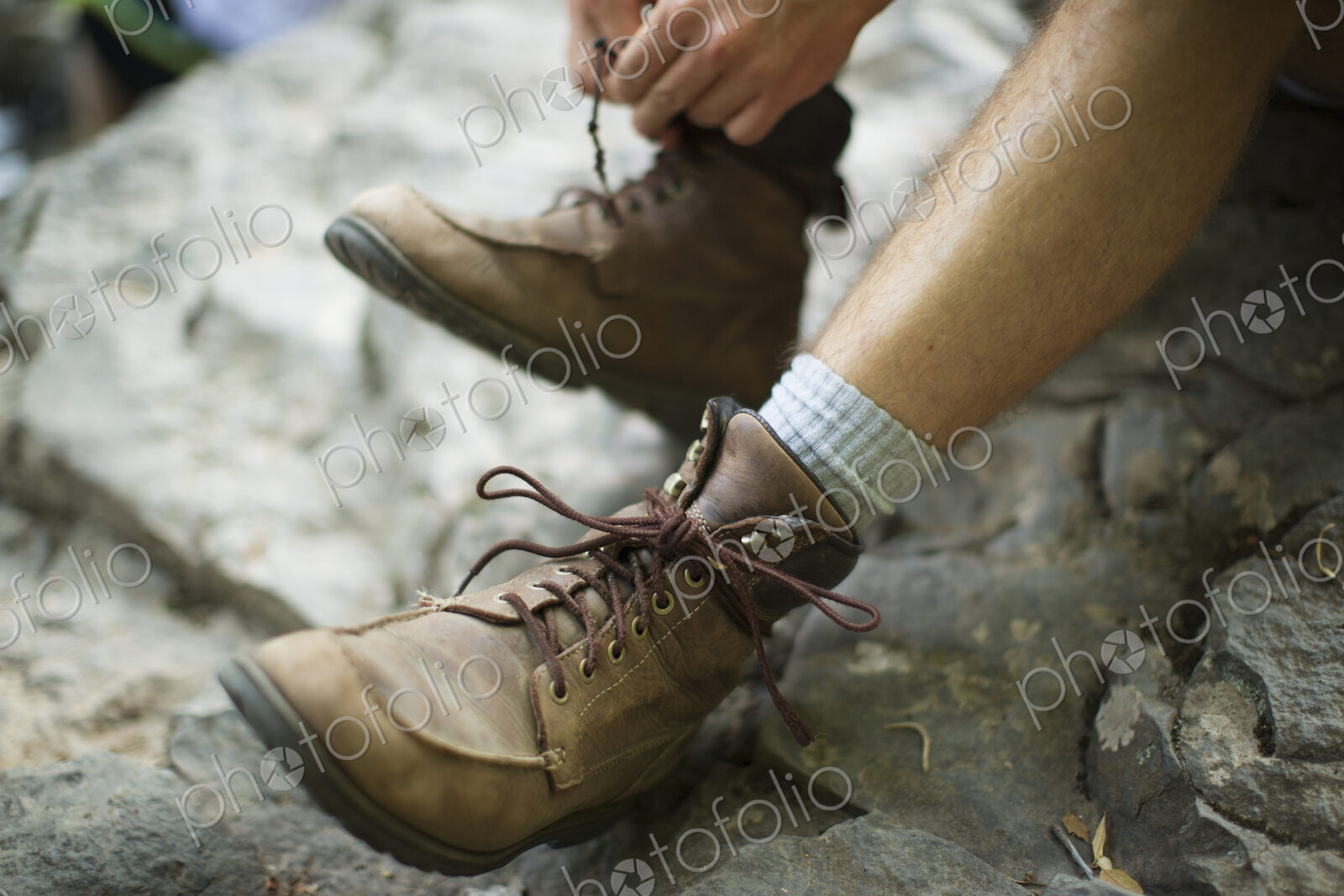 A man taking his boots off