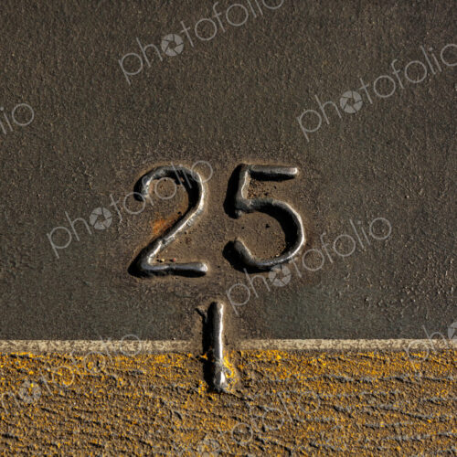 A mark, the number 25 on the metal hull of the Walla Walla Ferry, between Seattle and…