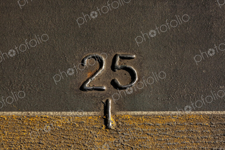 A mark, the number 25 on the metal hull of the Walla Walla Ferry, between Seattle and…
