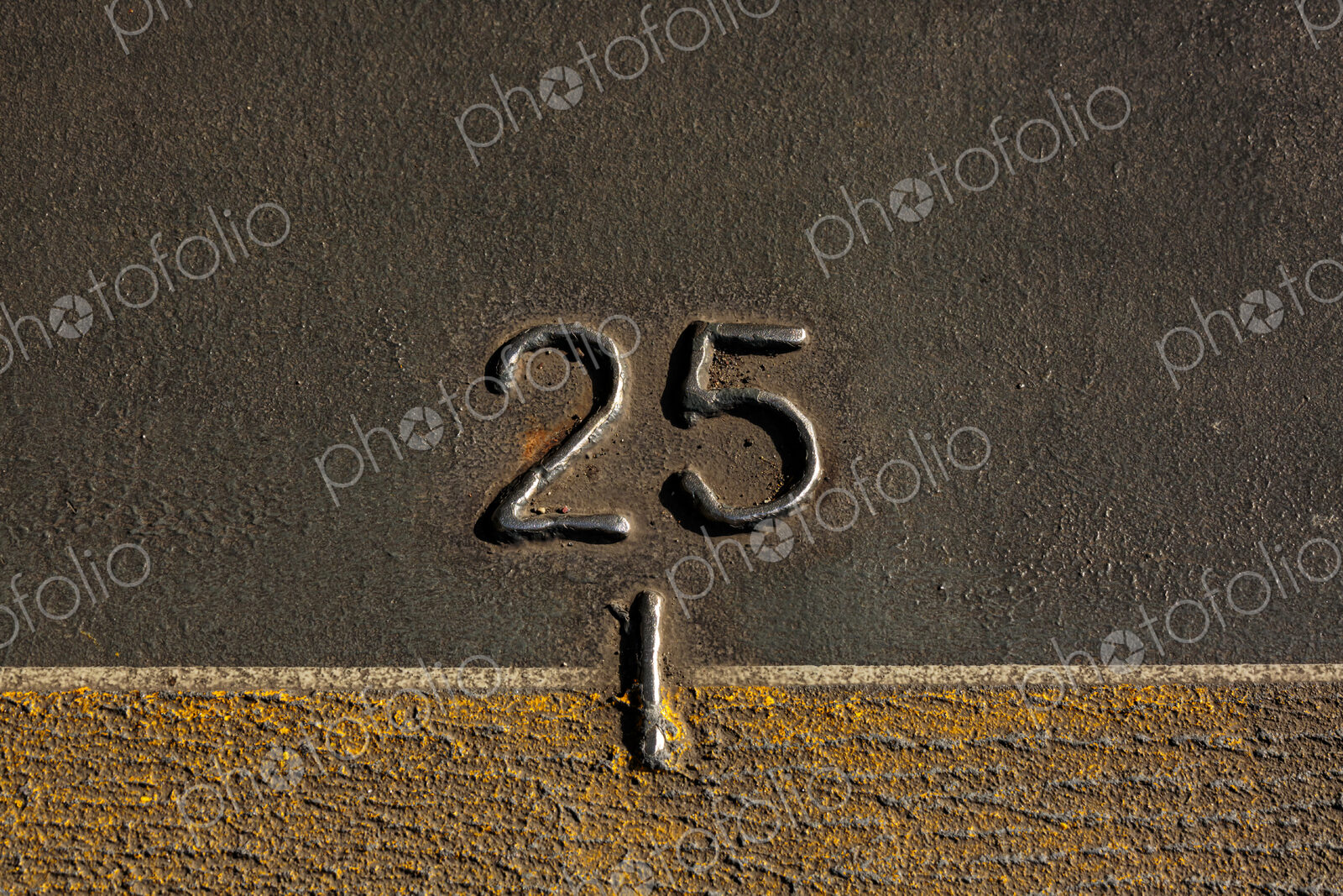A mark, the number 25 on the metal hull of the Walla Walla Ferry, between Seattle and…