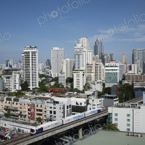 A mass transit train passes through Bangkok downtown business district. A mass transit train passes through Bangkok downtown business district.