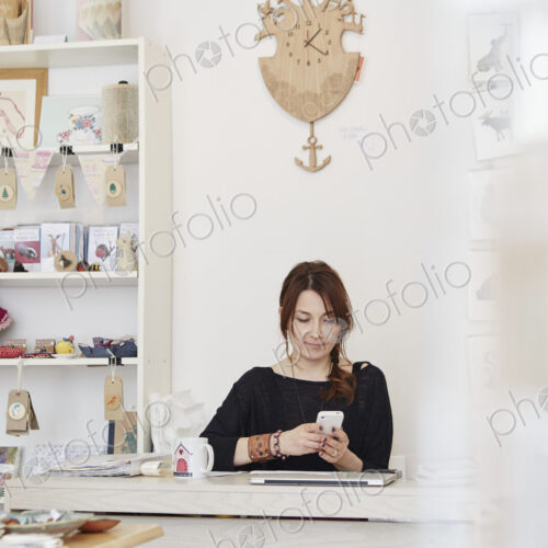 A mature woman running a small retail business.