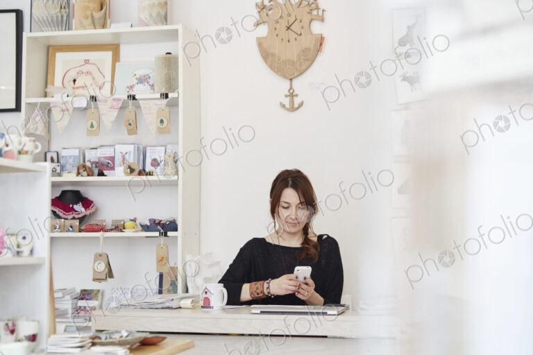 A mature woman running a small retail business.