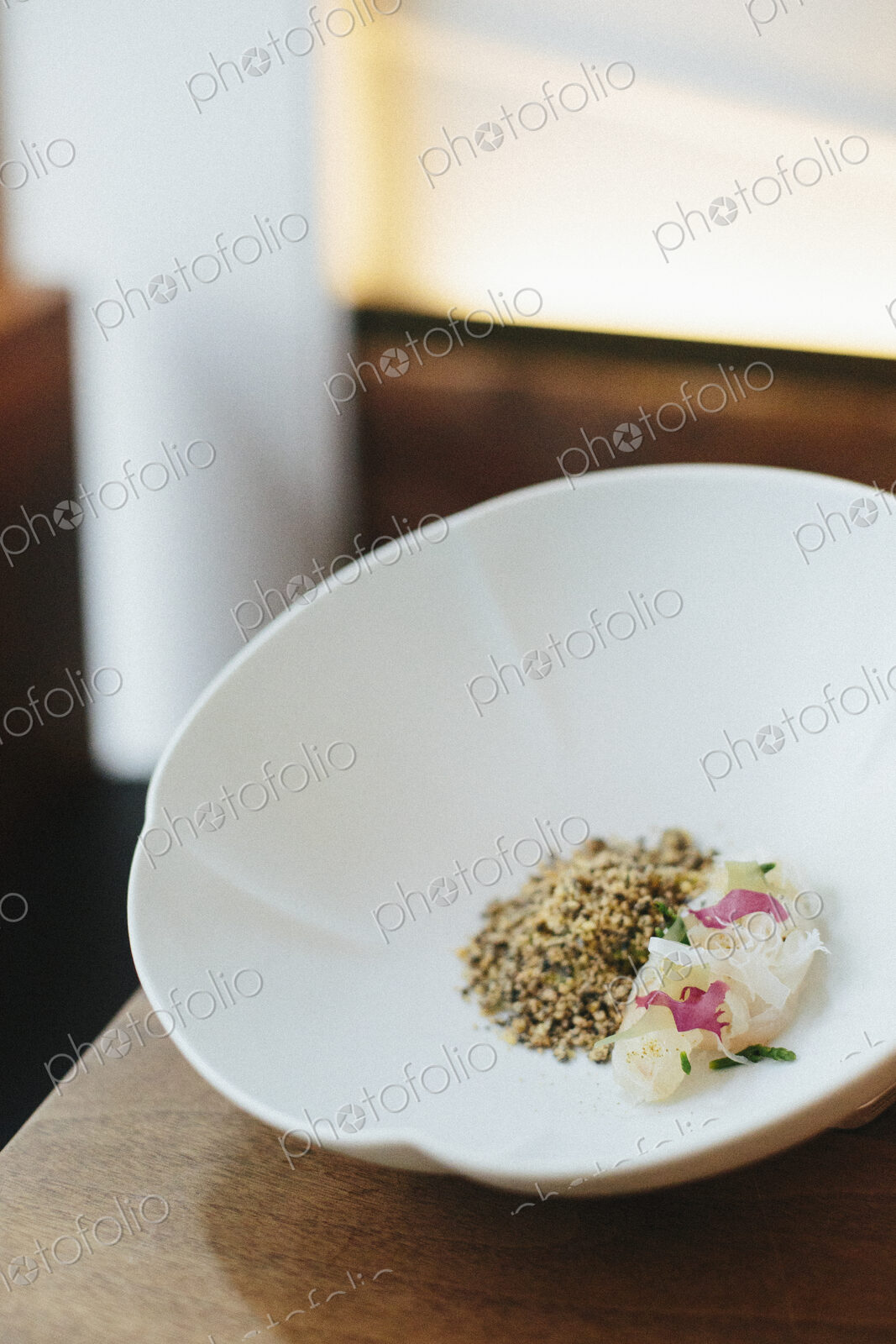 A menu dish served in a white bowl in a restaurant