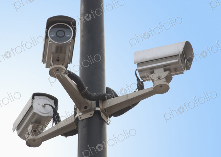 A metal post with a gantry and traffic cameras facing in three different directions…