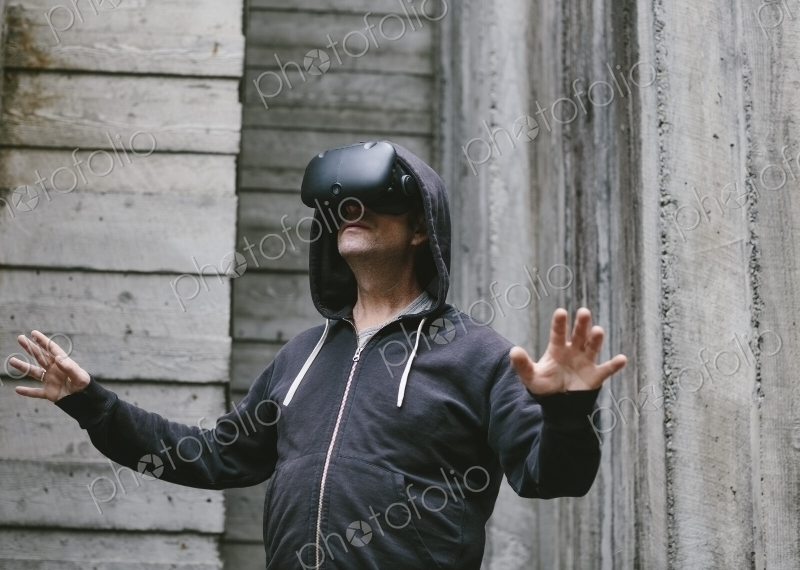 A middle aged man wearing a virtual reality headset.