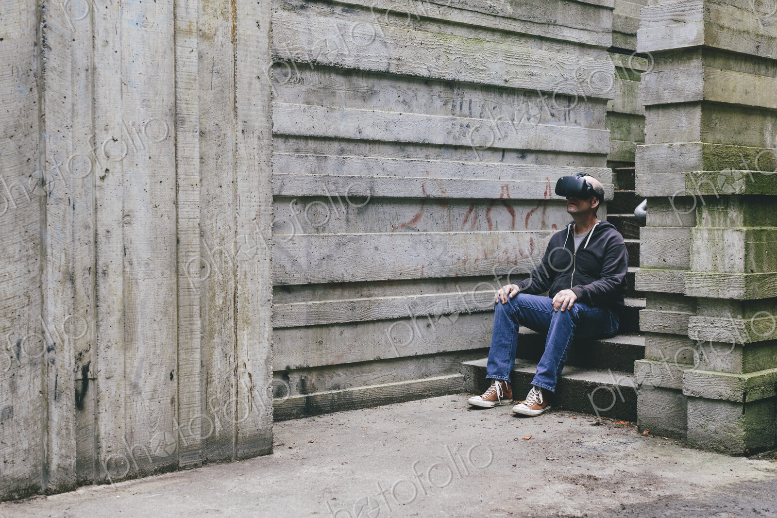 A middle aged man wearing a virtual reality headset.