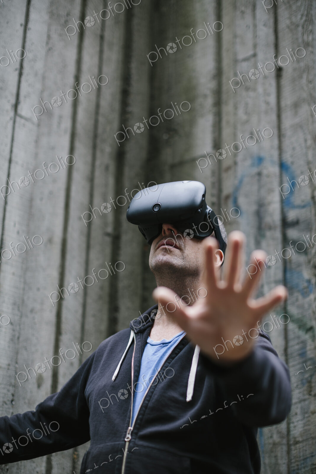A middle aged man wearing a virtual reality headset.