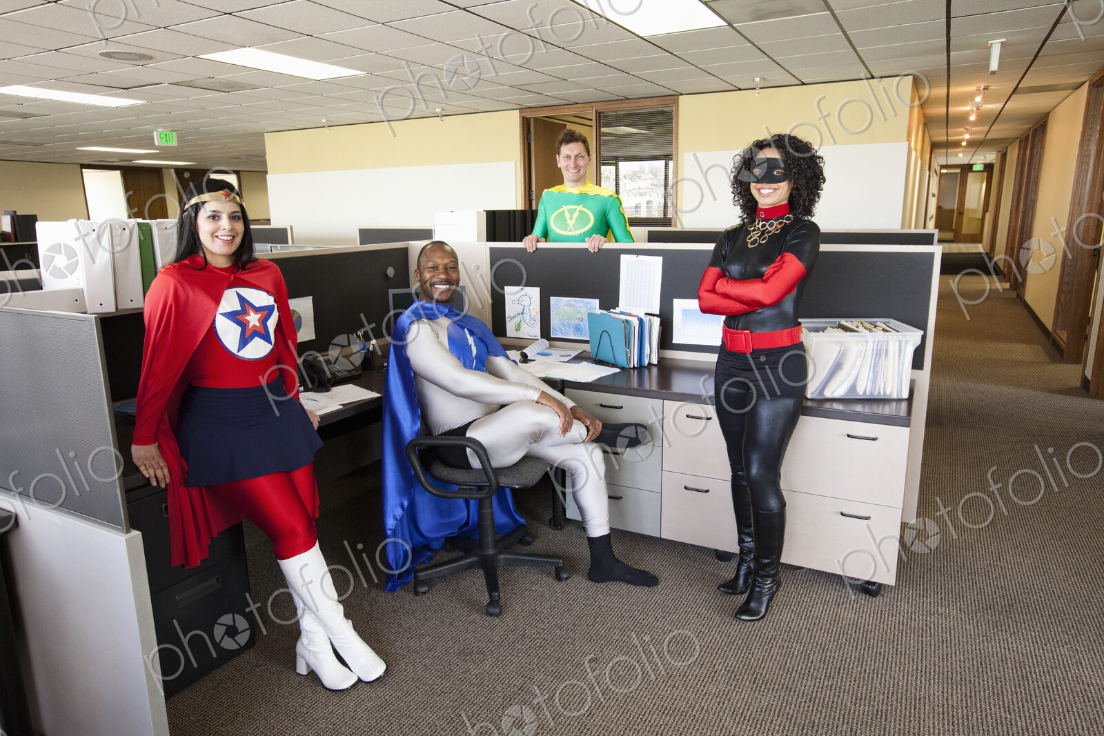 A mixed race team of office super hero’s in their office.