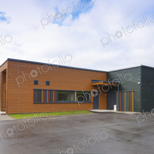 A modern building, a pre-school entrance and playground A modern building, a pre-school entrance and playground