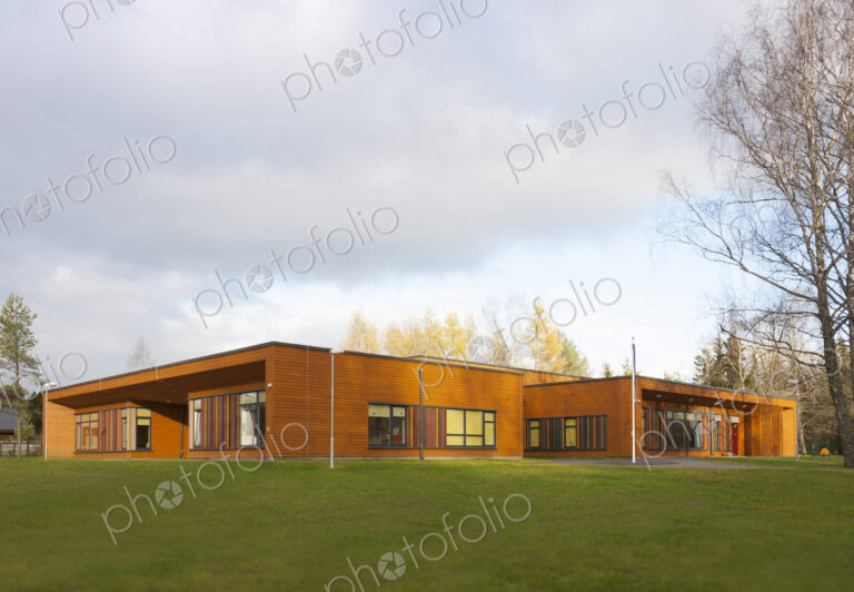 A modern pre-school or day care nursery, open space and grass.