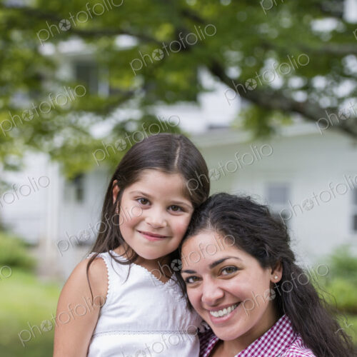 A mother and daughter in a country garden. A mother and daughter in a country garden.