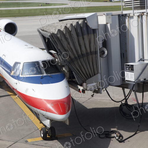A passenger aircraft and connected passenger boarding tunnel or airbridge