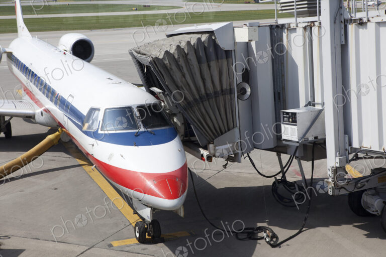 A passenger aircraft and connected passenger boarding tunnel or airbridge
