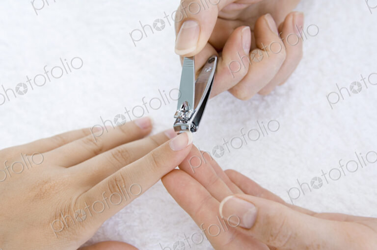 A person having a nail manicure.