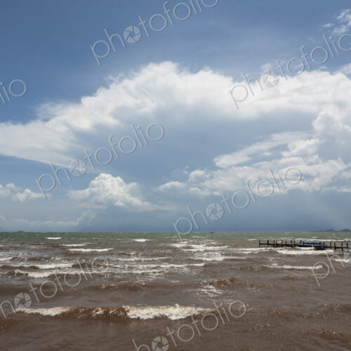 A pier juts into the Gulf of Thailand sea. A pier juts into the Gulf of Thailand sea.