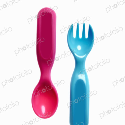 A pink plastic baby spoon and a blue fork.