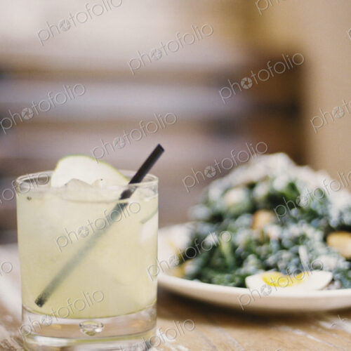A plate of cooked vegetables and soft boiled eggs, with garnishes.A glass of chilled… A plate of cooked vegetables and soft boiled eggs, with garnishes.A glass of chilled…