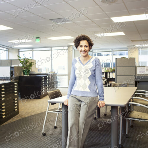 A portrait of a businesswoman in her office.